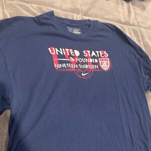Nike Men's Navy USA Soccer Graphic Long Sleeve Tee. From Fanatics Vintage